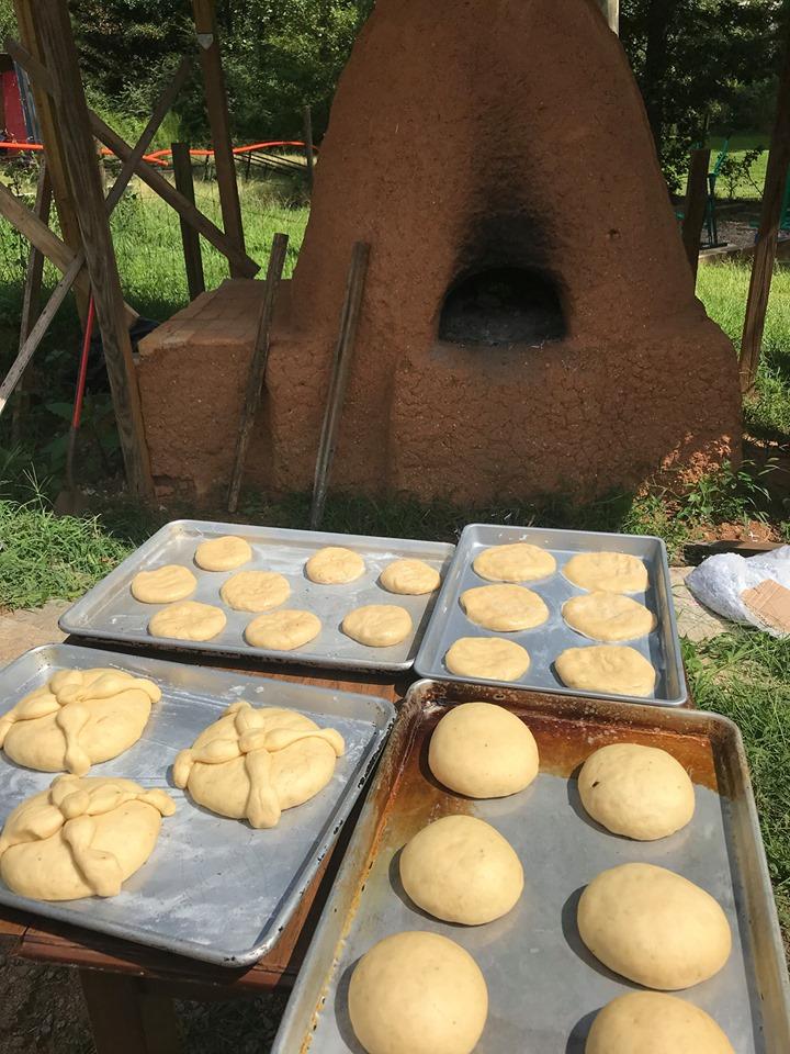 Preparing Bread to be baked in a traditional horno (adobe oven).